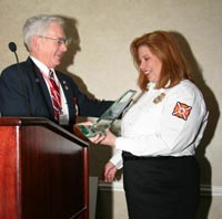 Dayna Hilton is presented the 2006 NVFC Fire Prevention Award