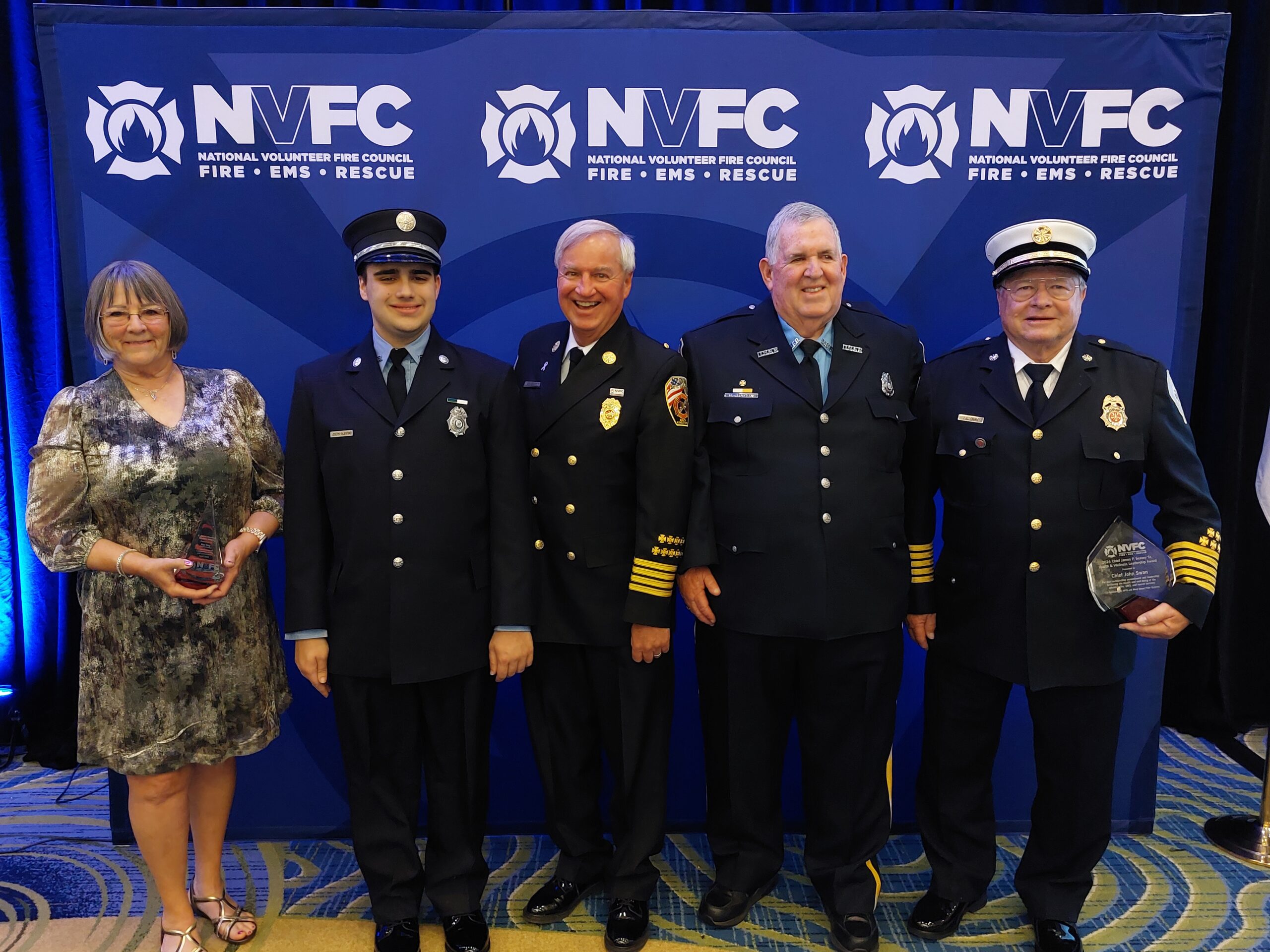 Award winners posed in front of NVFC backdrop